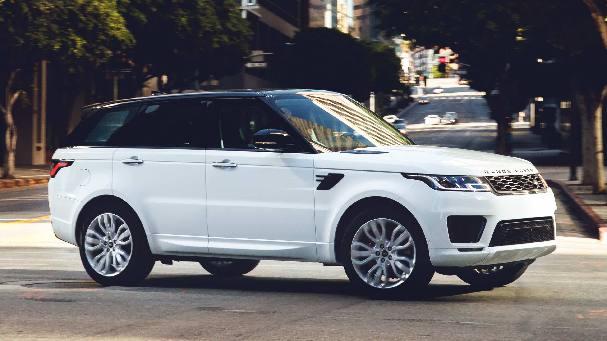 Range Rover Sport Driving Onto The City Road